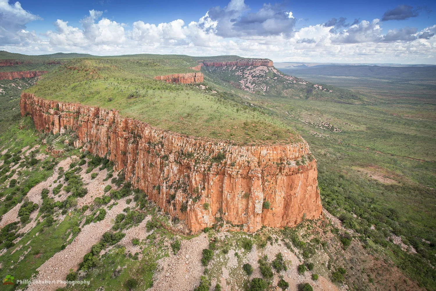 A small group walks together on a guided outback trail